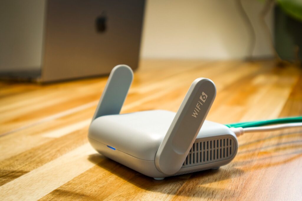 WiFi 6 router with antennas on wooden desk for best WiFi router India 2026