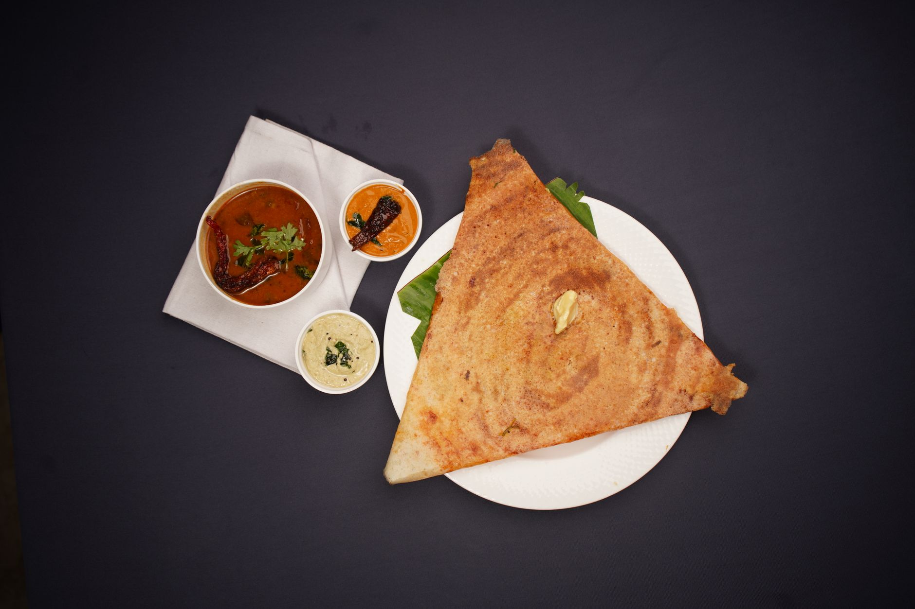 Masala dosa served with chutneys and sambar — made with wet grinder batter for authentic taste