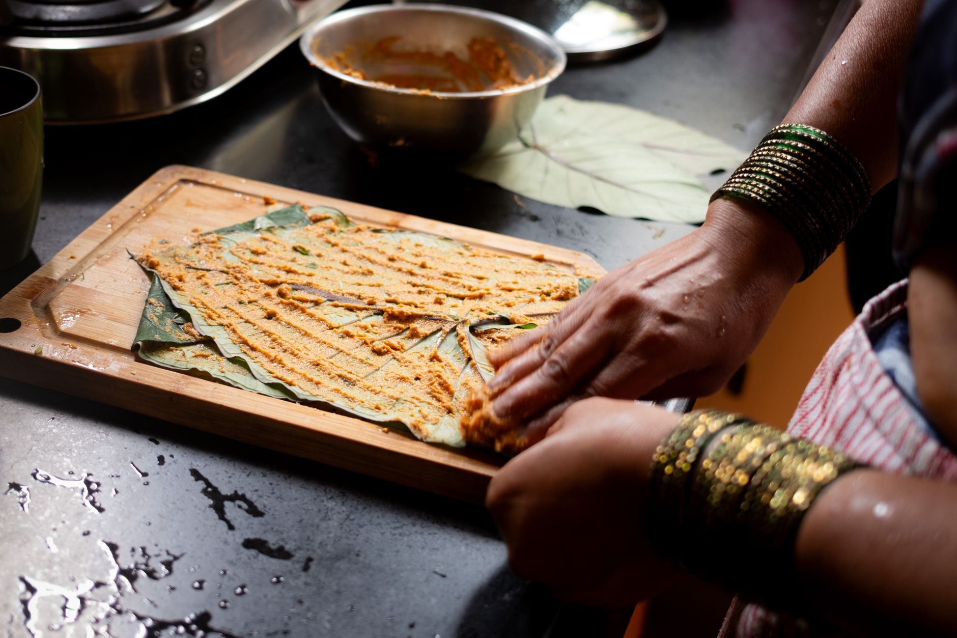 Chef preparing South Indian food with freshly ground batter — wet grinder results in authentic cooking