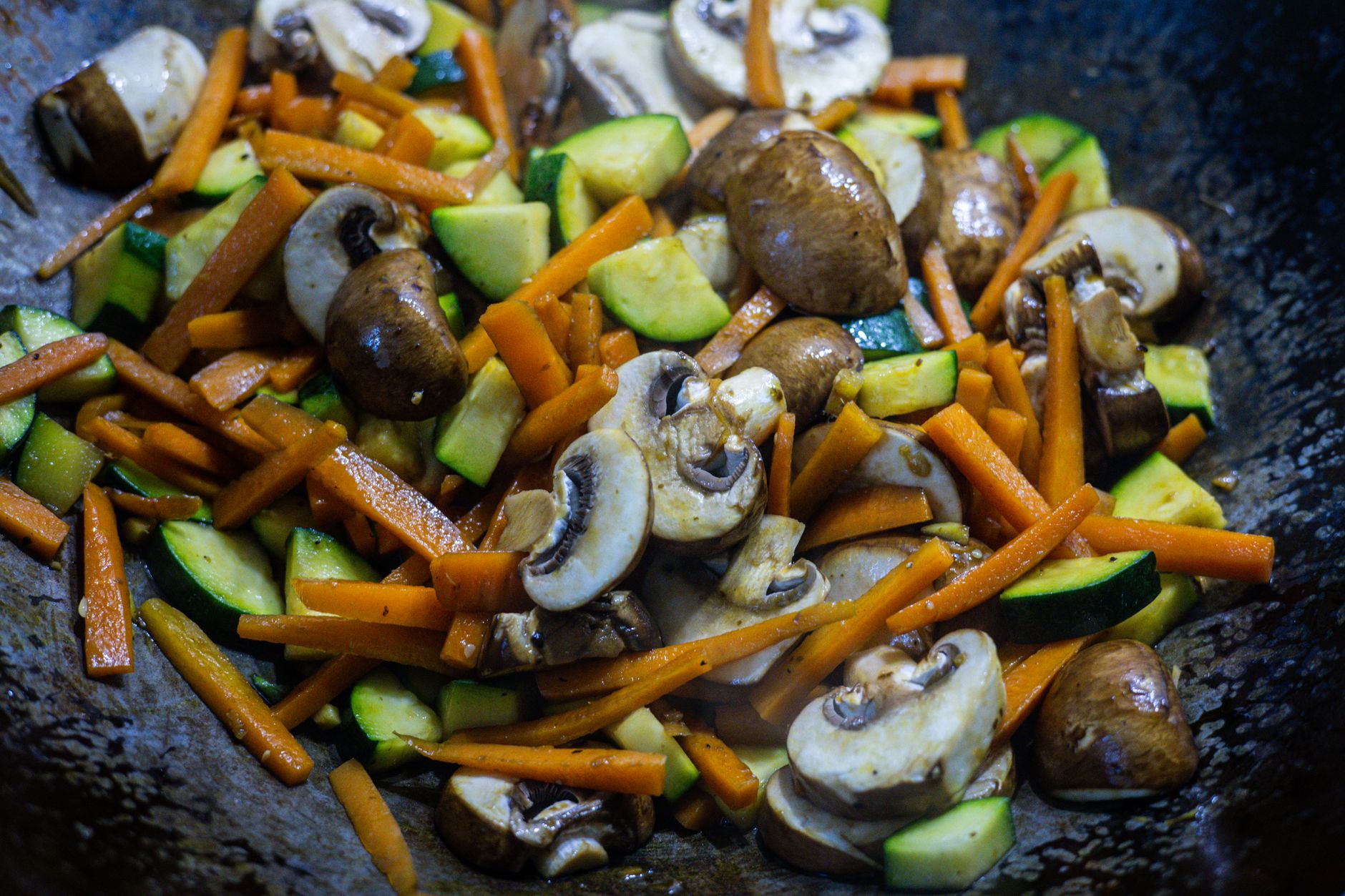 Vegetables stir-fried in a wok — kadai cooking in an Indian kitchen