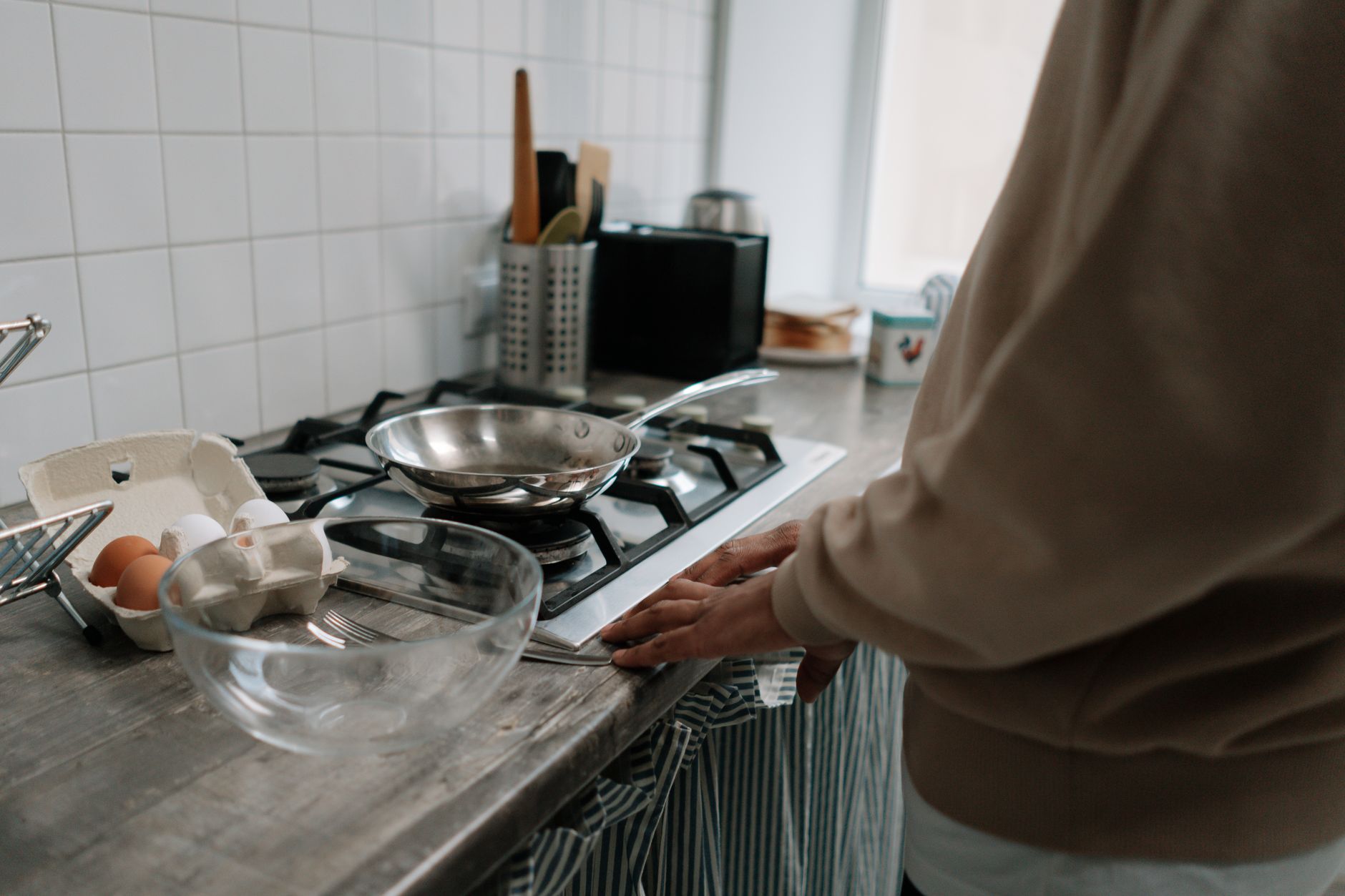Eggs and cookware on kitchen counter for morning cooking