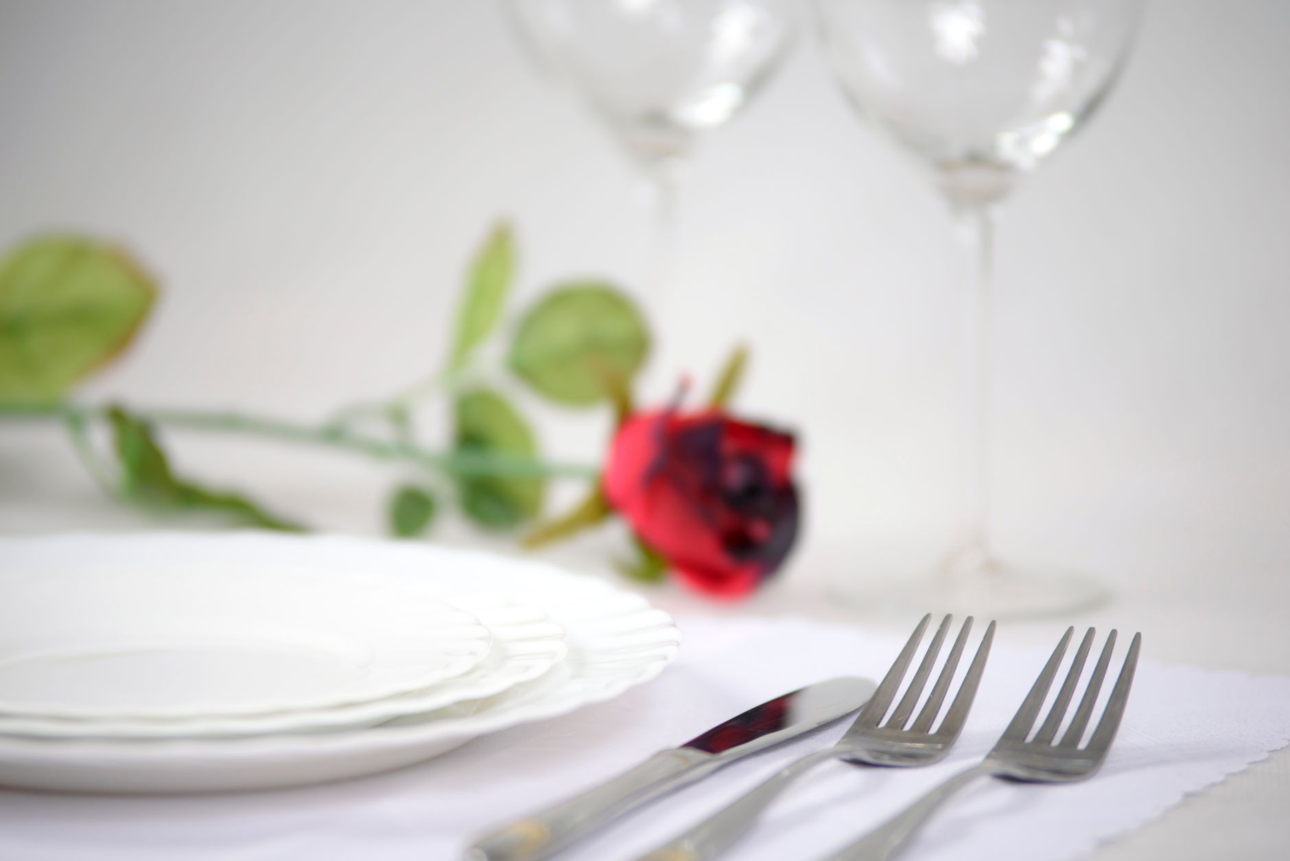 Elegant formal dinner table setting with plates and cutlery — representative of Corelle's classic tableware style