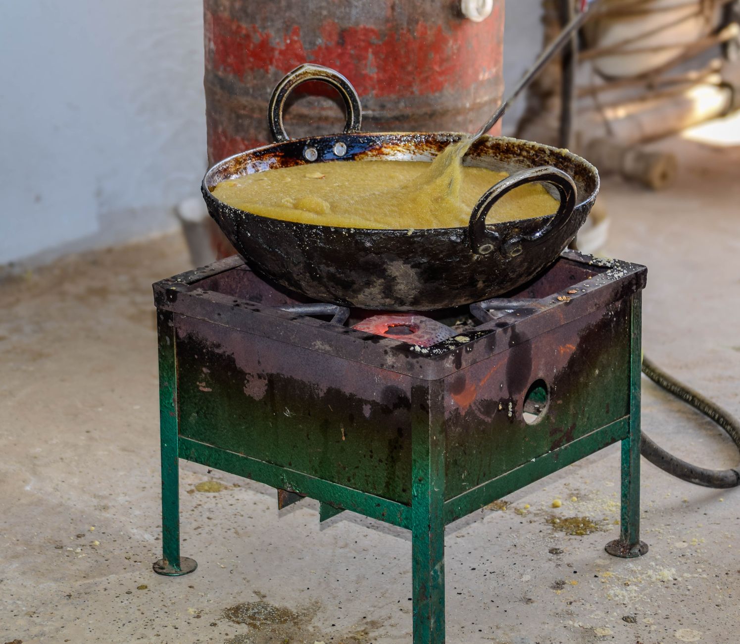 Traditional Indian dish being cooked in stainless steel kadai