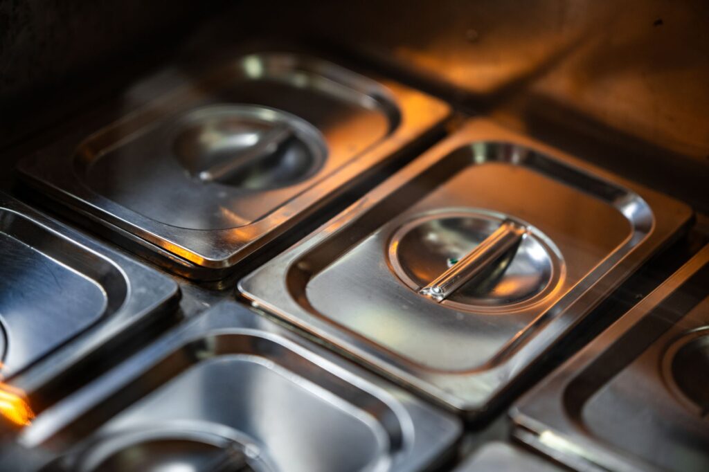 Stacks of shiny stainless steel food containers for Indian kitchen storage