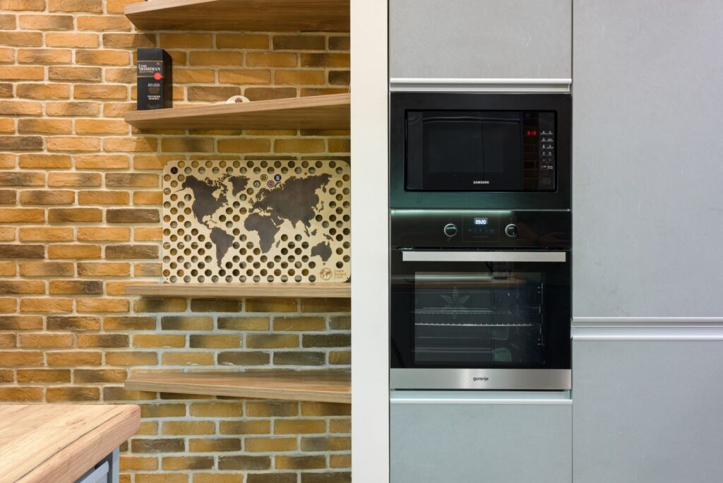 Modern kitchen with built-in appliances including microwave oven