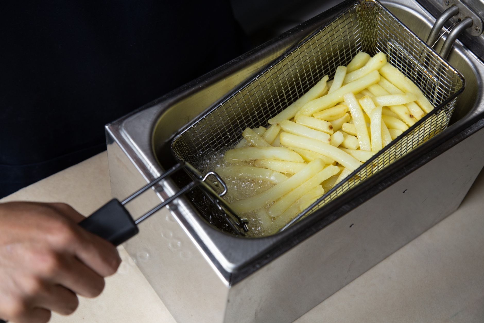 Crispy french fries cooked with less oil using an air fryer — a healthier alternative to deep frying