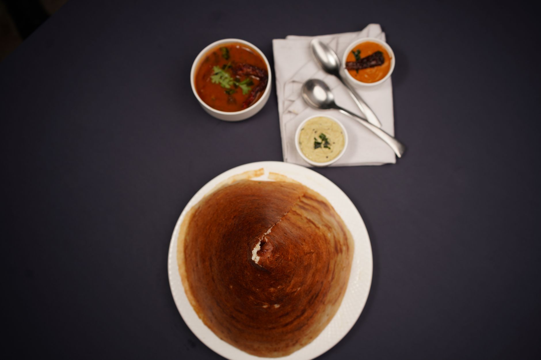 Traditional South Indian dosa and idli served with sambar and coconut chutney — made with wet grinder batter