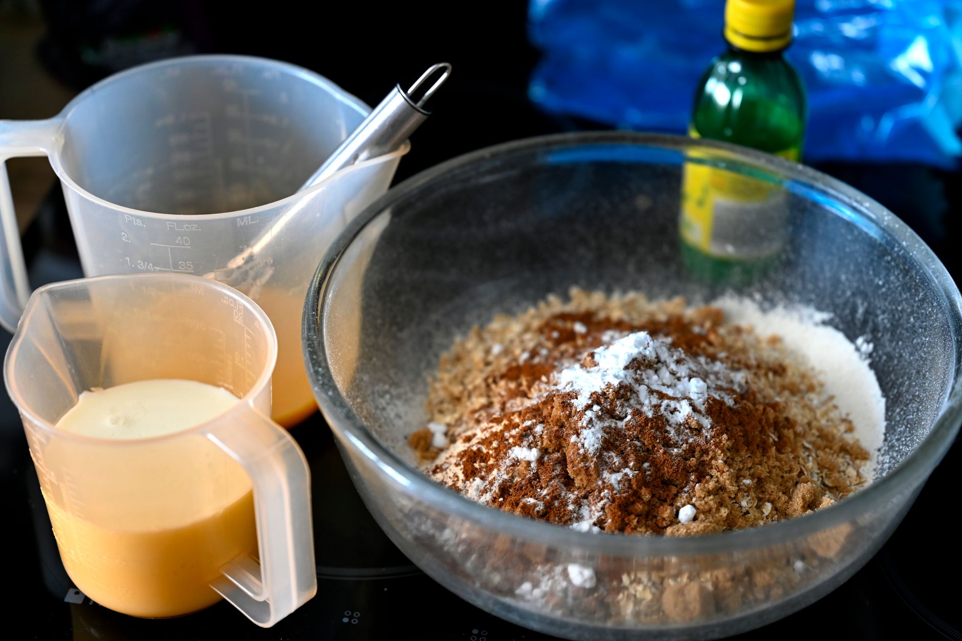 Baking ingredients in glass bowl on kitchen counter ready for scale measurement