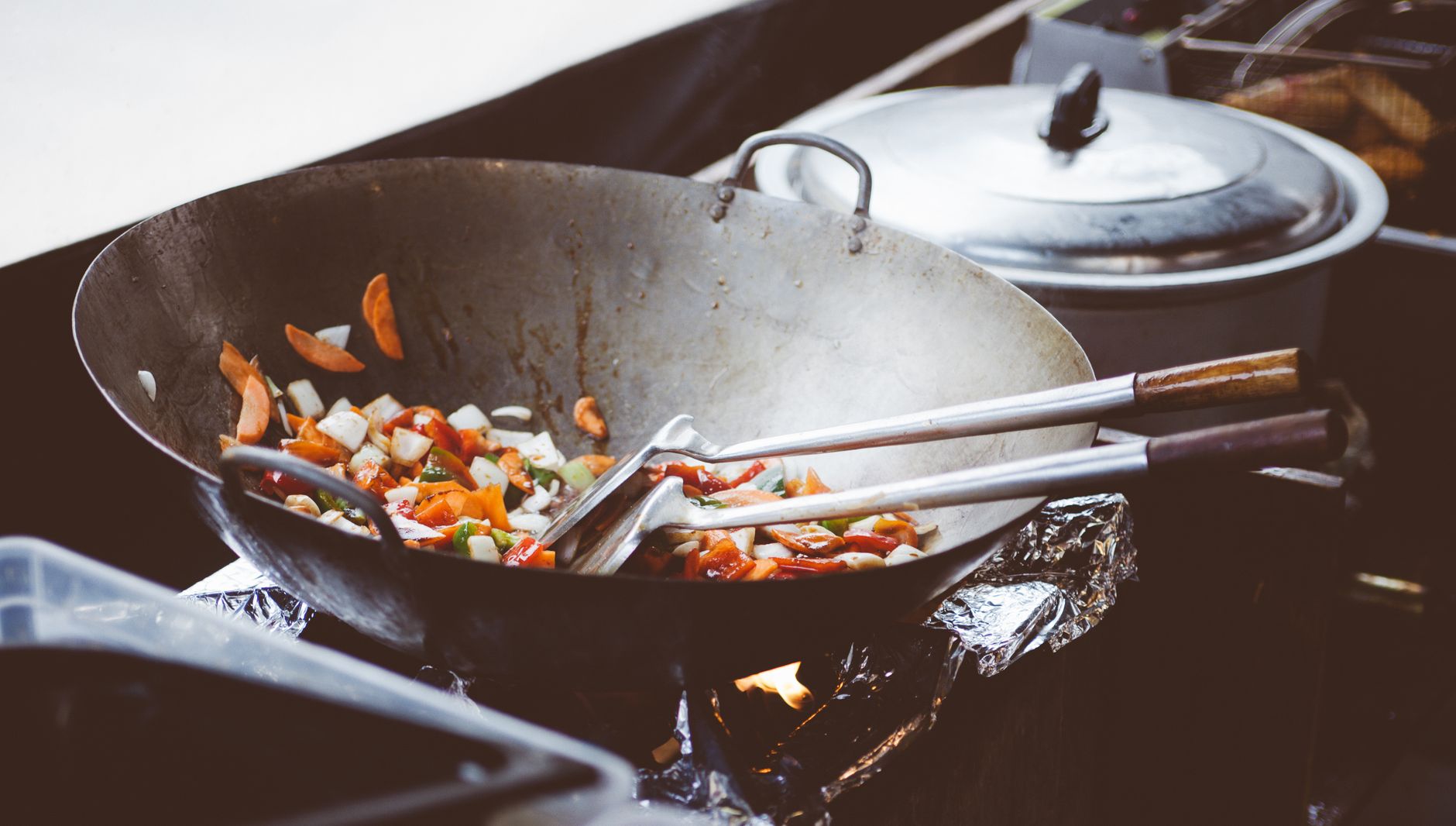 Meyer non-stick wok pan suitable for stir frying vegetables on induction cooktop