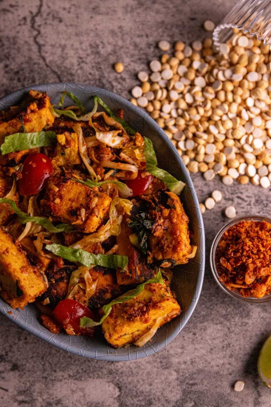 Stir fry vegetables in a heavy cast iron kadai wok